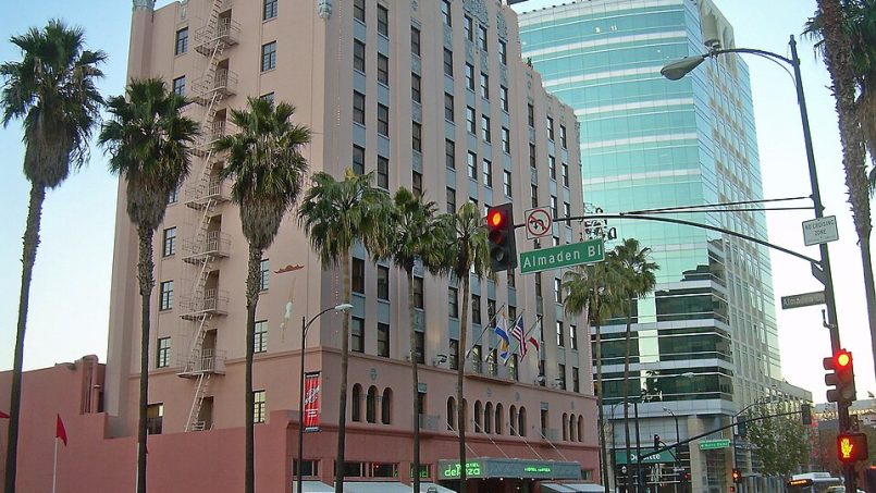 Hotel De Anza exterior with rooftop sign